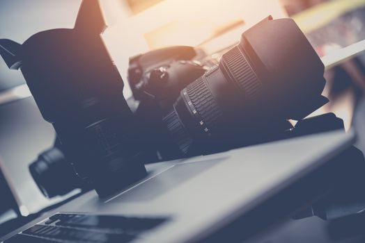 Photo Business Equipment. Modern Computer, Digital Camera and Professional Prime Lenses. Doing Photography For a Living Concept..