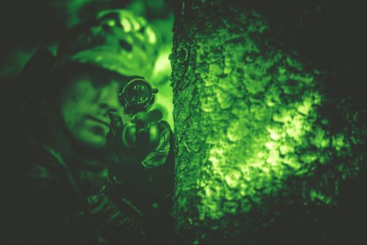 Hunting Poacher with Riffle in Night Vision Color Grading.