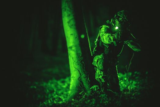 Soldier in Night Vision View. Military Concept Photo. Night Vision Color and Noise Grading.