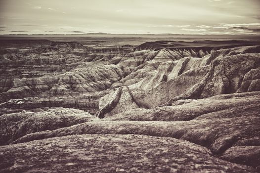 South Dakota Badlands Raw Dramatic Landscape. Badlands in Western State of South Dakota, United States of America. Dramatic Duotone Sepia Color Grading.