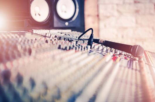 Studio Mixer and the Microphone. Audio Recording Concept Photo. Sound Systems.