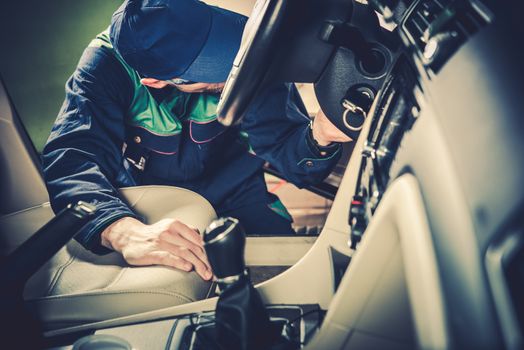 Used Car Maintenance. Auto Service Technician Checking Vehicle Interior Looking For Issues.