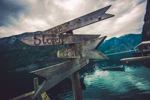 Wooden Direction Sign Somewhere in Norway. Traveling in Norway Photo Concept.