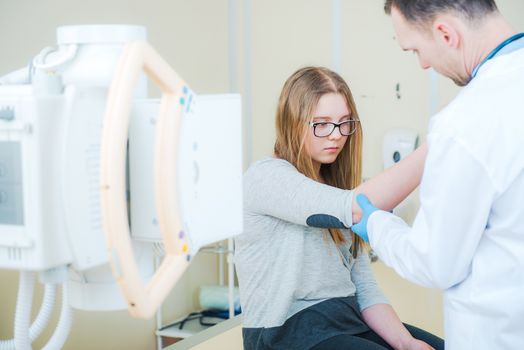 Doctor Examining Broken Arm and Preparing For Xray Imaging. Healthcare Photo Concept.