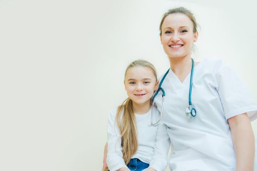 Happy Little Hospital Patient with Her Female Medical Doctor. 