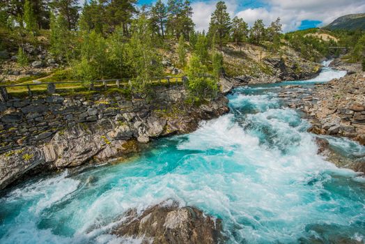 Wild Rushing Mountain River. Crystal Clear Waters of Norwegian River.