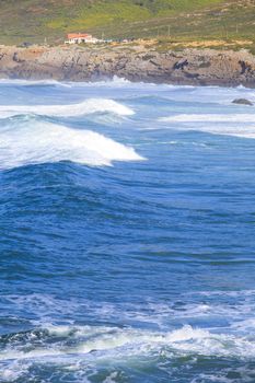 Rocky Coast Extending into the Sea