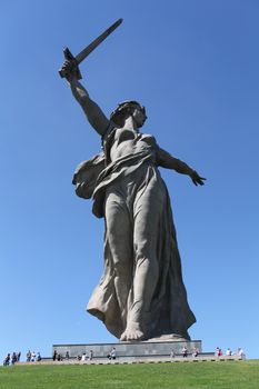 Volgograd Russia ,August 28, 2013  Small people at a giant monument Homeland mother, symbol of fighters and defenders of Stalingrad. Stalingrad battle, Mamayev Kurgan  