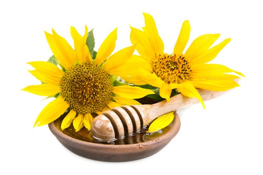 clay dish with honey drizzler and flowers sunflowers