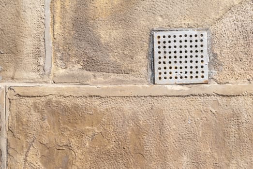 fragment of a concrete wall, which has undergone deformation due to prolonged exposure to various climatic conditions