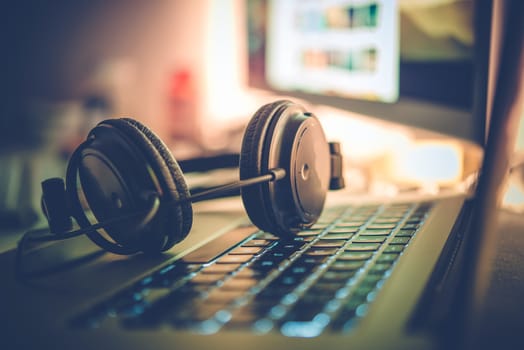 Digital Music Creation Theme with Professional Headphones on the Computer Keyboard.