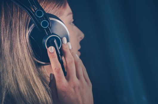 Girl Listening the Music on Her Headphones. Online Digital Music and Mobile Audio Devices Theme.