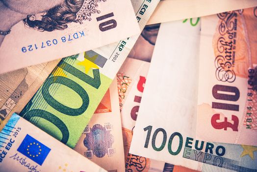 British Pound To Euro Forex Concept. European Currency Euro To British Pound. Pile of Banknotes Closeup.