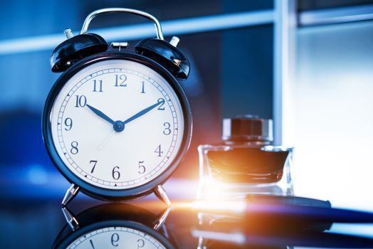 Business on Time. Corporate Concept with Elegant Vintage Style Clock, Fountain Pen and Ink on the Stylish Glassy Executive Desk. Business Timing.