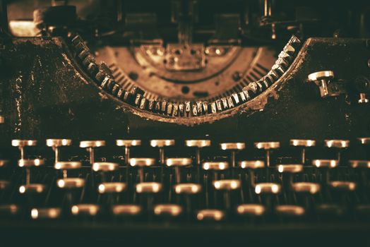 Aged Typewriter Machine. Vintage Typewriter Front View. Sepia Color Grading.