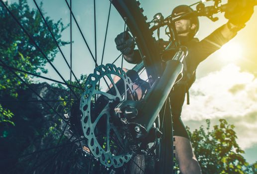 Extreme Biking Concept. Bike Front Wheel Brakes Closeup Perspective.