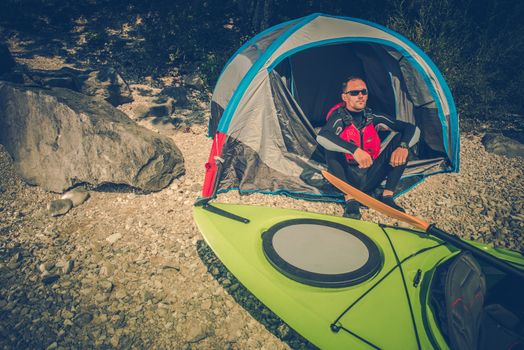 Lake Shore Camping Place. Men Camping on the Lake Shore and Taking Kayak Trips. Outdoor Lifestyle.