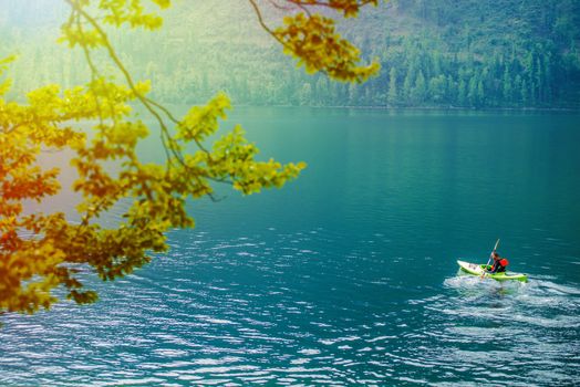 Scenic Kayak Tour on the Lake in a Summer Day. Kayaking Theme.