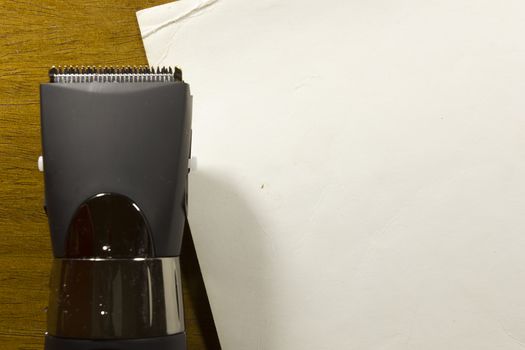 Hair clipper style on the wooden background