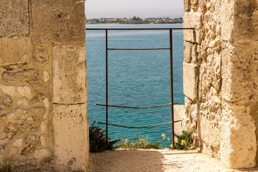 Scenic view of Maniace castle on sea, Syracuse, Sicily, Italy