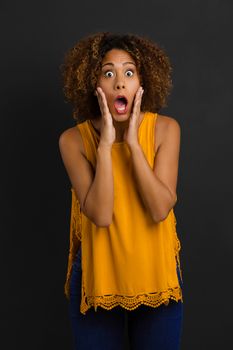 Beautiful African American woman with a astonished expression