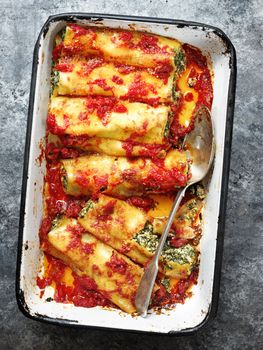 close up of rustic italian spinach ricotta cannelloni pasta