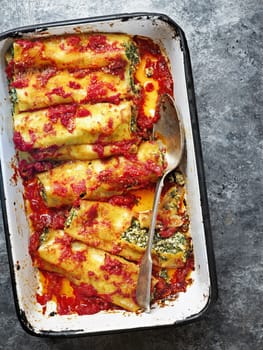 close up of rustic italian spinach ricotta cannelloni pasta