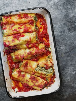 close up of rustic italian spinach ricotta cannelloni pasta