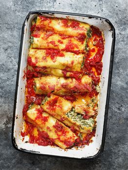 close up of rustic italian spinach ricotta cannelloni pasta