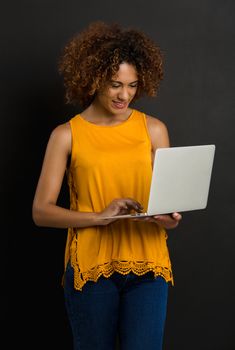 Beautiful African American woman working on a laptop