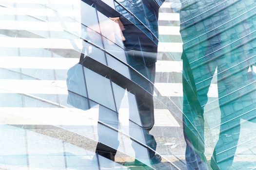 Abstract double exposure of businessman and office buildings