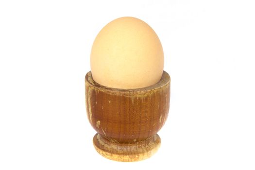 A soft-boiled egg into a vintage wood cup