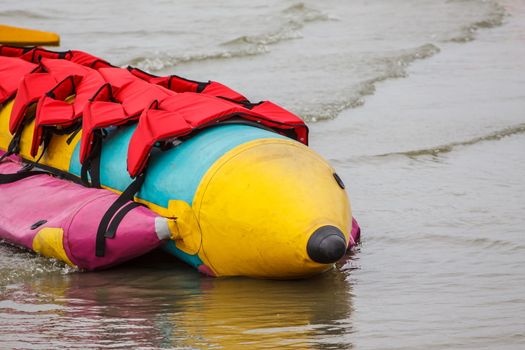 Banana boat lays on the beach