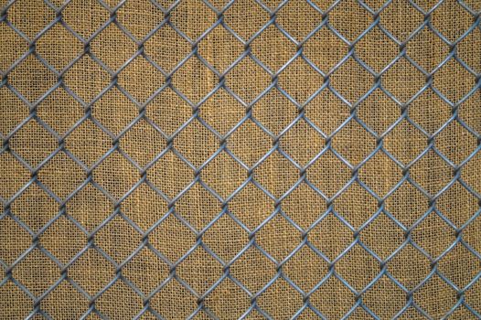 background of metal mesh on the old fabric