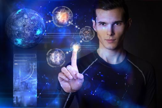 Man touching digital planets on hologram screen with his finger