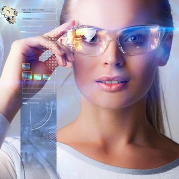 Woman in futuristic glasses work with abstract holografic data