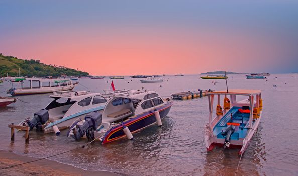 Boats on the beach at Gili Trawangan in Indonesia at sunset