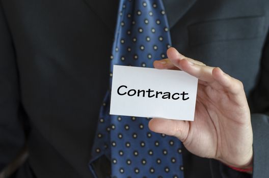 Contract text note concept over business man background