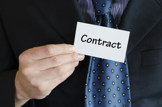 Contract text note concept over business man background