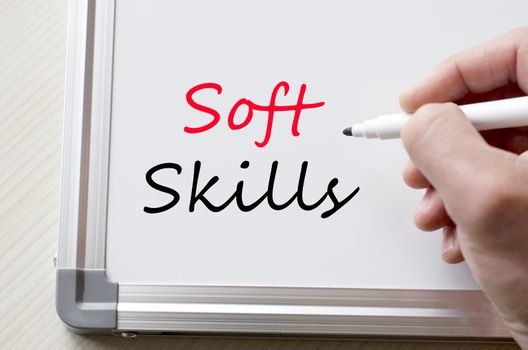 Human hand writing soft skills on whiteboard