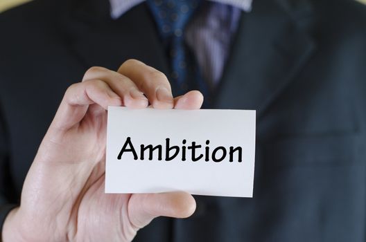 Ambition text note concept over business man background