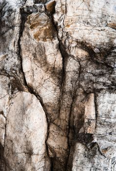 abstract background dark fissured limestone rock