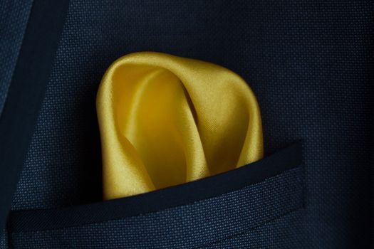 close up of a Yellow handkerchief in a jacket pocket