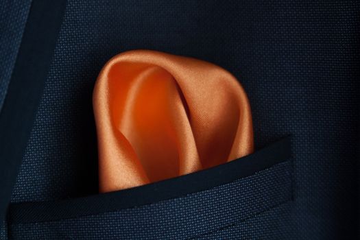 close up of a Orange Handkerchief in jacket pocket