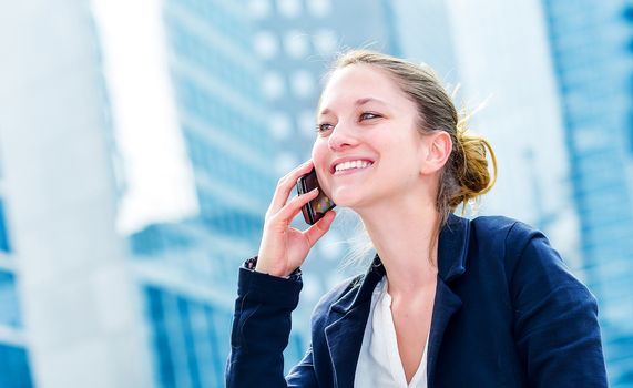 dynamic young executive calling outside, free of any constraint. Symbolizing a job search or a trade of outsourcing