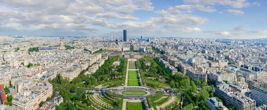 Panorama of southeastern part of Paris from the Eiffel Tower with Field of Mars on the foreground in spring day
