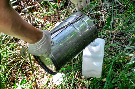 Take samples of water for laboratory testing. The concept - analysis of water purity, environment, ecology