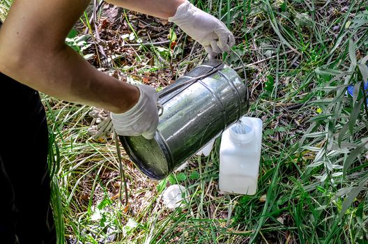 Take samples of water for laboratory testing. The concept - analysis of water purity, environment, ecology