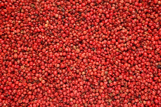 Pink peppercorns as an abstract background texture
