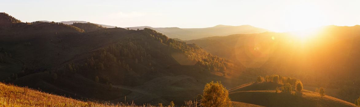 Beauty sunset in the mountains in Altay, panoramic picture